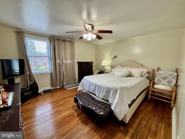 bedroom featuring wood finished floors and a ceiling fan