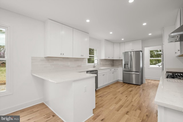 9828 Watts Branch Dr, Rockville, MD 20850 - kitchen with stainless steel appliances, backsplash, recessed lighting, a peninsula, and healthy amount of natural light
