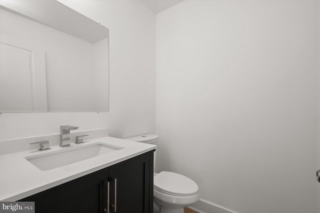 9828 Watts Branch Dr, Rockville, MD 20850 - bathroom with toilet, vanity, and baseboards