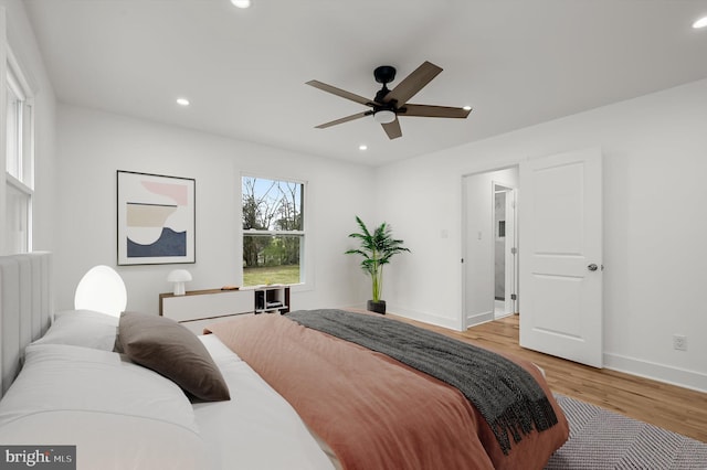 9828 Watts Branch Dr, Rockville, MD 20850 - bedroom with light wood-style flooring, baseboards, recessed lighting, and a ceiling fan