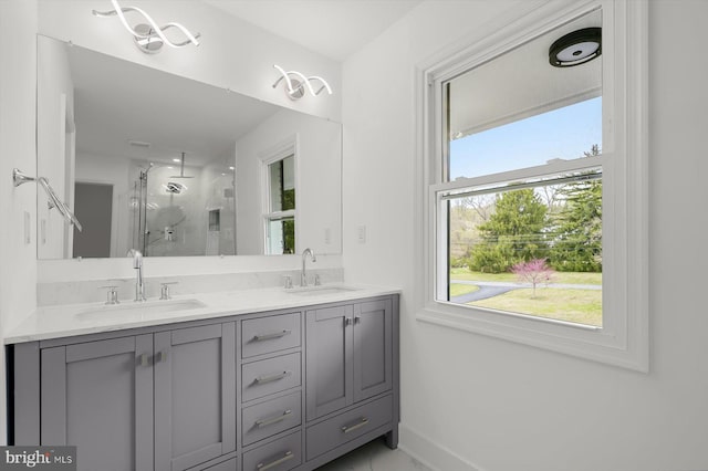 9828 Watts Branch Dr, Rockville, MD 20850 - bathroom featuring a shower stall, double vanity, and baseboards