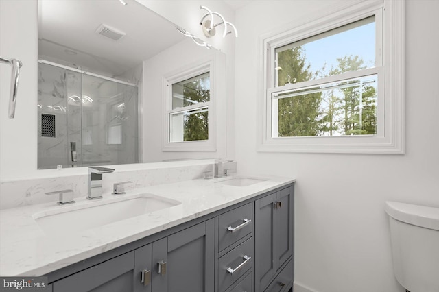 9828 Watts Branch Dr, Rockville, MD 20850 - full bath featuring toilet, a marble finish shower, and double vanity