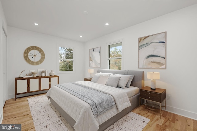 9828 Watts Branch Dr, Rockville, MD 20850 - bedroom with light wood finished floors, recessed lighting, and baseboards