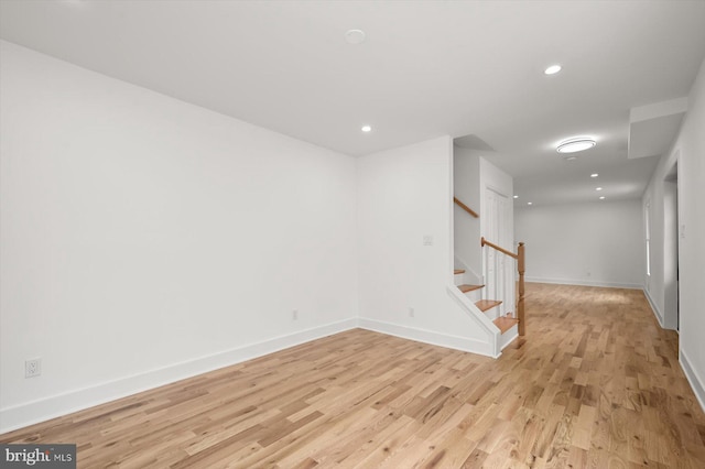 9828 Watts Branch Dr, Rockville, MD 20850 - basement featuring light wood-style floors, baseboards, stairs, and recessed lighting