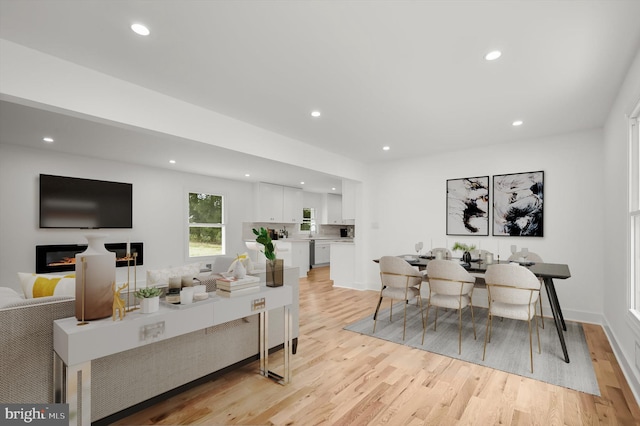 9828 Watts Branch Dr, Rockville, MD 20850 - living room with light wood-style floors and recessed lighting