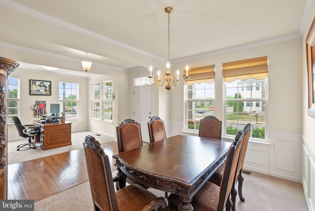 13859 Barrymore Ct, Gainesville, VA 20155 - dining area with a chandelier, a wainscoted wall, a desk, crown molding, and light wood-type flooring
