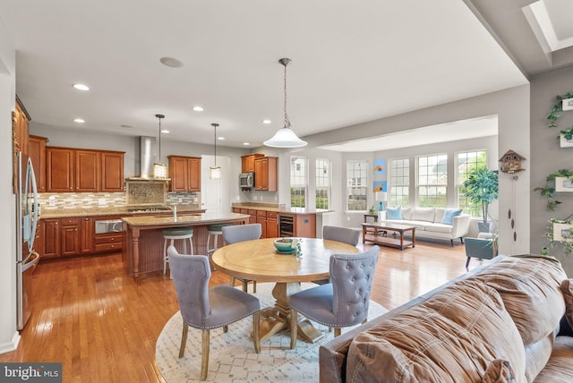 13859 Barrymore Ct, Gainesville, VA 20155 - dining room featuring recessed lighting, light wood-style floors, and beverage cooler