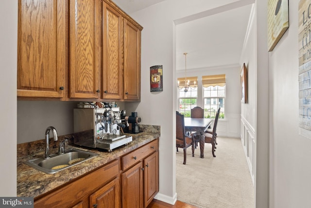 13859 Barrymore Ct, Gainesville, VA 20155 - bar area with a sink, a chandelier, light carpet, and a wainscoted wall