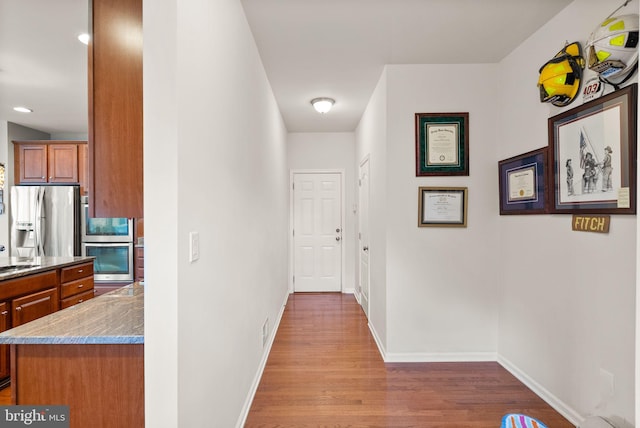 13859 Barrymore Ct, Gainesville, VA 20155 - hall featuring wood finished floors and baseboards