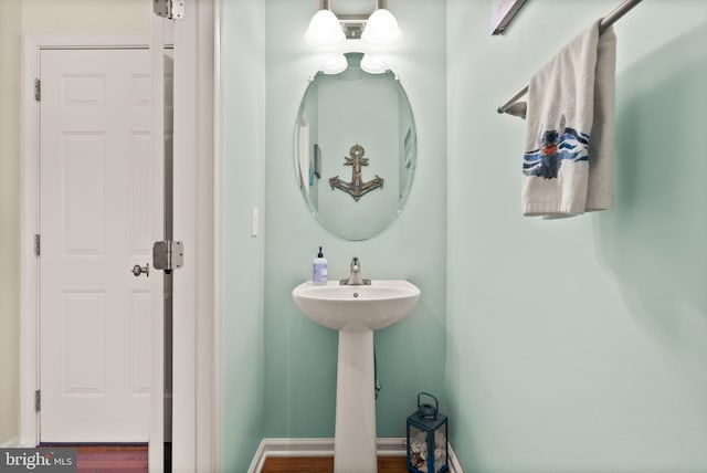 13859 Barrymore Ct, Gainesville, VA 20155 - bathroom featuring wood finished floors, a sink, and baseboards