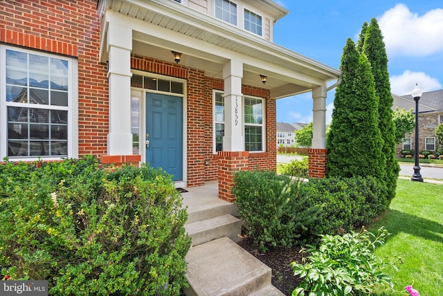 13859 Barrymore Ct, Gainesville, VA 20155 - doorway to property with brick siding and a yard