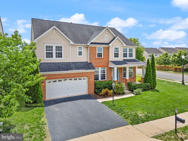 13859 Barrymore Ct, Gainesville, VA 20155 - craftsman house featuring an attached garage, driveway, brick siding, a front yard, and roof with shingles
