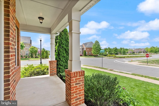 13859 Barrymore Ct, Gainesville, VA 20155 - view of patio / terrace featuring covered porch and a residential view