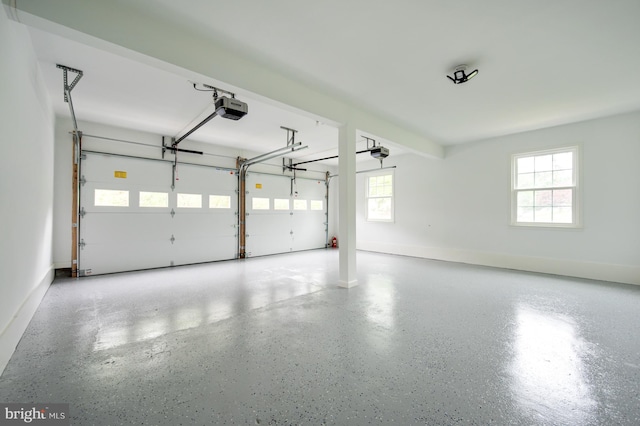 garage featuring baseboards and a garage door opener