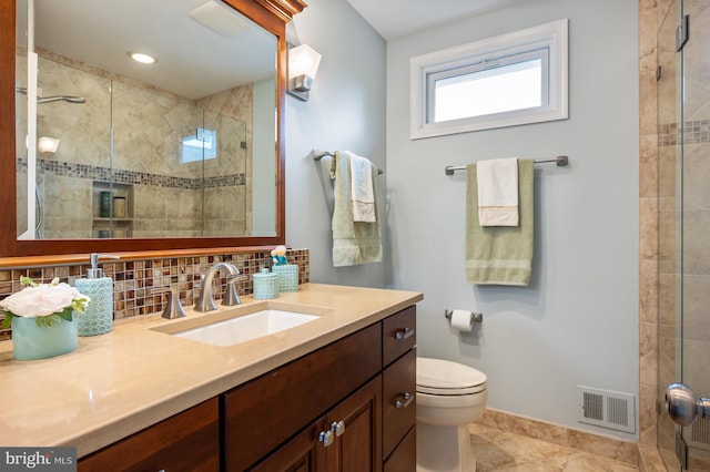 bathroom featuring vanity, visible vents, tasteful backsplash, and a shower stall