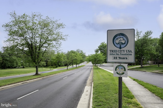 view of road with curbs and sidewalks