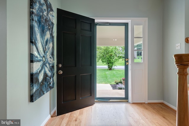 entrance foyer featuring wood finished floors and baseboards
