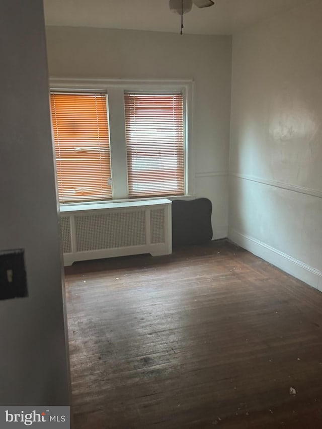 235 E Price St, Philadelphia, PA 19144 - empty room with radiator, ceiling fan, and hardwood / wood-style flooring