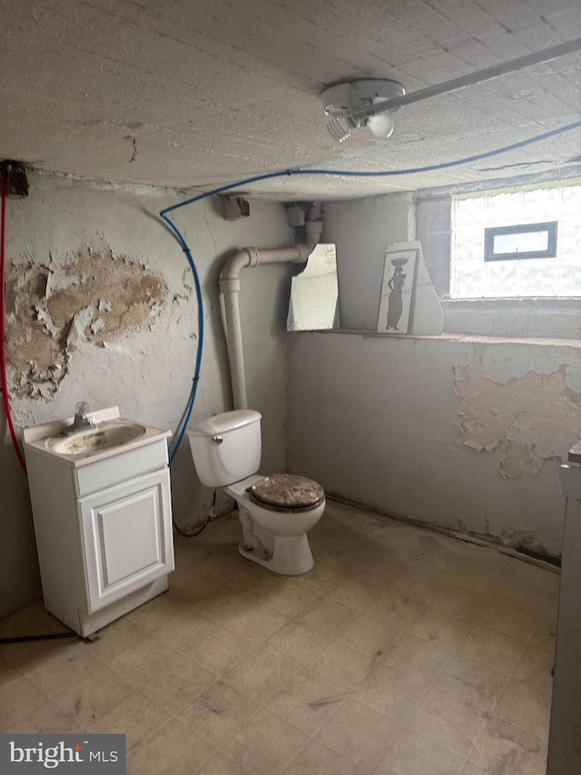 235 E Price St, Philadelphia, PA 19144 - half bathroom featuring vanity, toilet, and tile patterned floors
