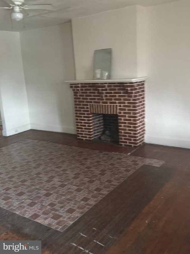 235 E Price St, Philadelphia, PA 19144 - unfurnished living room with a ceiling fan, baseboards, a fireplace, and wood finished floors