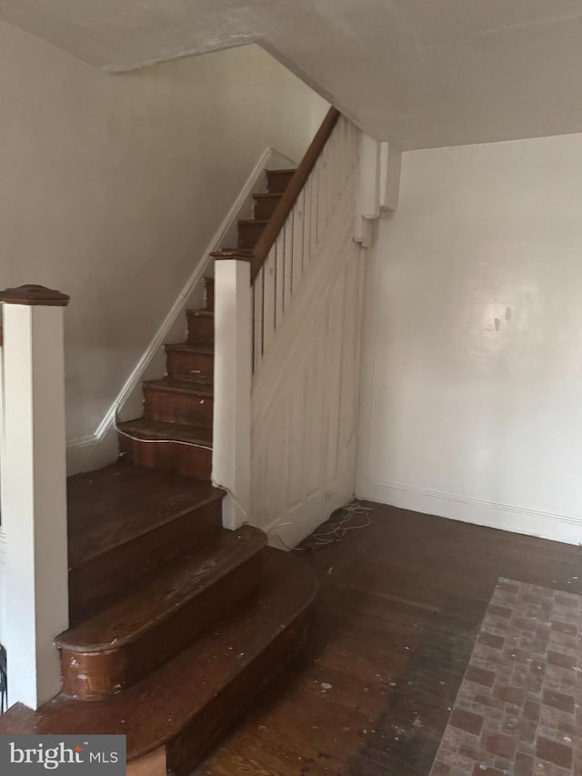 235 E Price St, Philadelphia, PA 19144 - staircase with baseboards and wood finished floors