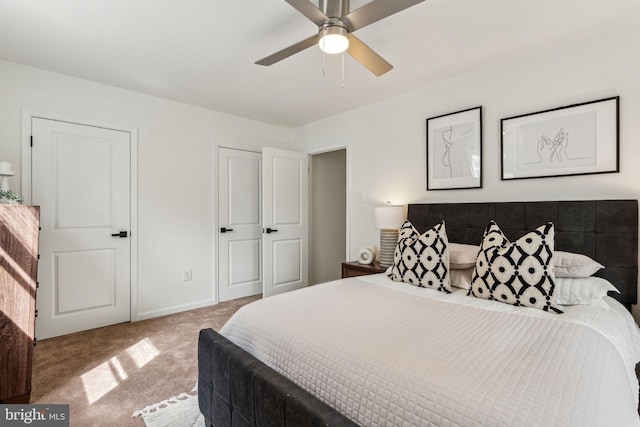 bedroom with carpet flooring, baseboards, and ceiling fan