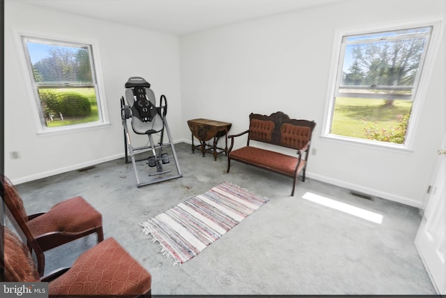 sitting room with healthy amount of natural light and baseboards