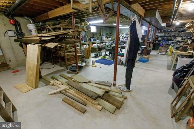 unfinished basement with a workshop area