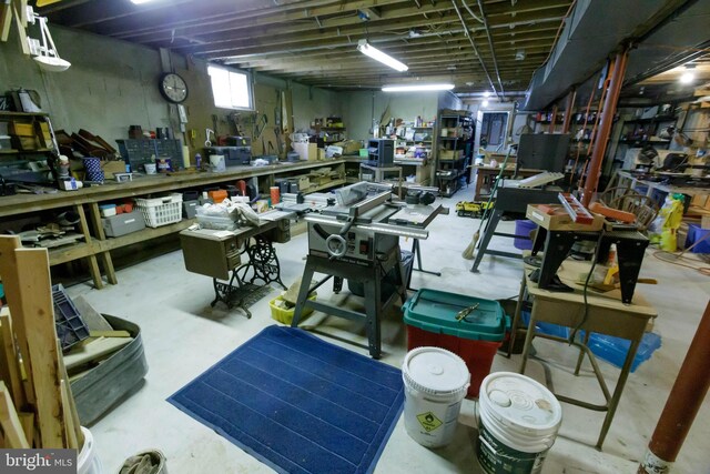 misc room featuring concrete floors and a workshop area