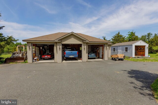 view of building exterior featuring a detached garage