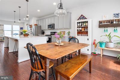 2038 Twisted Oak Pl, Hanover, MD 21076 - dining room featuring dark wood-type flooring and recessed lighting