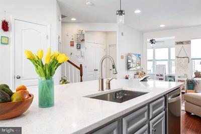 2038 Twisted Oak Pl, Hanover, MD 21076 - kitchen with recessed lighting, stainless steel dishwasher, gray cabinetry, a sink, and open floor plan