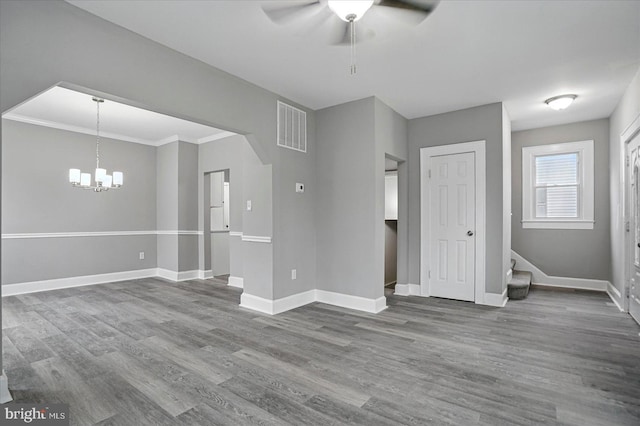4911 Fox St, College Park, MD 20740 - unfurnished living room with baseboards, dark wood-type flooring, visible vents, and ceiling fan with notable chandelier