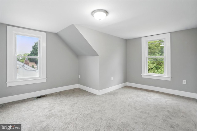 4911 Fox St, College Park, MD 20740 - bonus room with baseboards, carpet, and vaulted ceiling