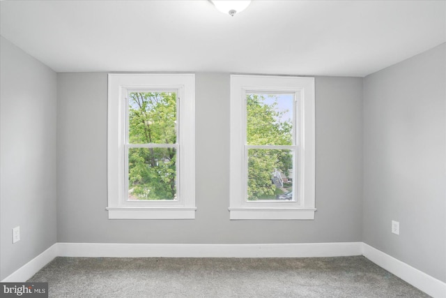 4911 Fox St, College Park, MD 20740 - carpeted empty room with baseboards