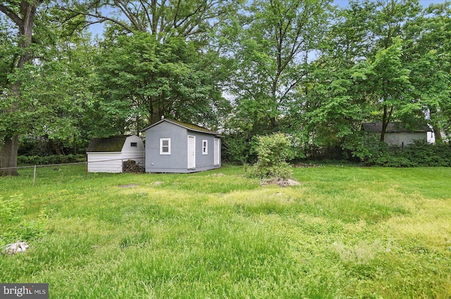 4911 Fox St, College Park, MD 20740 - view of yard with fence, a shed, and an outbuilding
