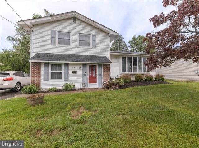 730 Cheryl Dr, Warminster, PA 18974 - view of front facade with roof with shingles, a front lawn, and brick siding