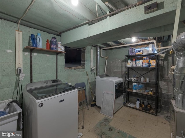 730 Cheryl Dr, Warminster, PA 18974 - unfinished basement featuring tile patterned floors, concrete block wall, washer and dryer, and a sink