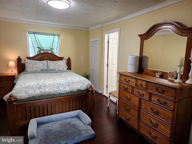 bedroom with crown molding and dark wood-type flooring