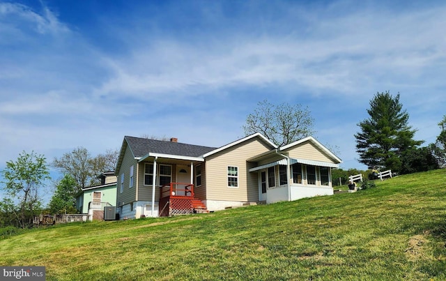 exterior space with a chimney and a front yard