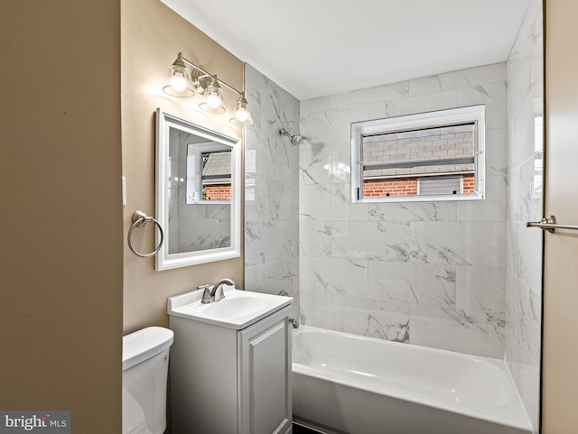 full bathroom featuring toilet, vanity, and tub / shower combination