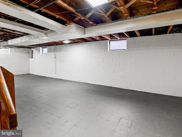 basement featuring a wealth of natural light and tile patterned floors