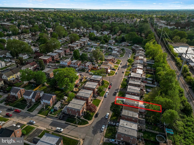 birds eye view of property with a residential view