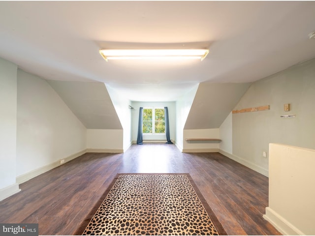 bonus room featuring wood finished floors, lofted ceiling, and baseboards