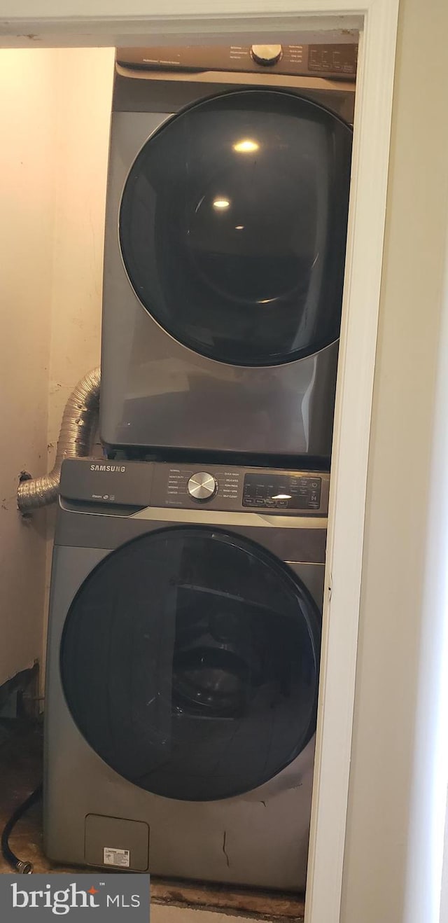 washroom with laundry area and stacked washer and dryer