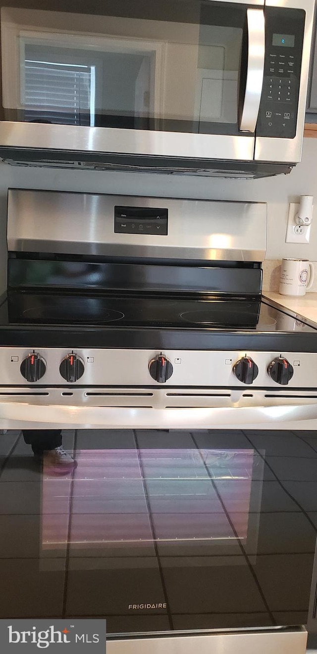 kitchen featuring stainless steel microwave