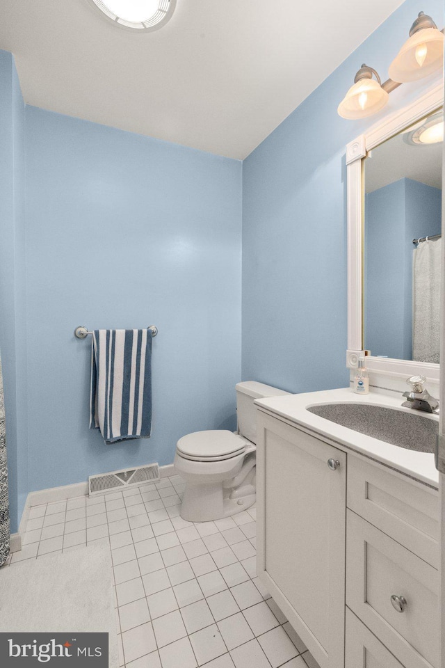 21 Heisler Ave, Charlestown, MD 21914 - full bath with toilet, vanity, and tile patterned flooring