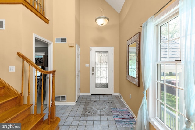 21 Heisler Ave, Charlestown, MD 21914 - tiled foyer entrance featuring baseboards, a towering ceiling, and stairs