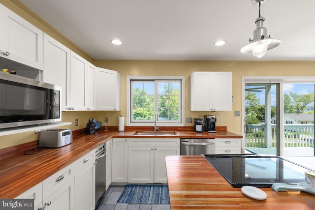 21 Heisler Ave, Charlestown, MD 21914 - kitchen with wood counters, a sink, appliances with stainless steel finishes, white cabinetry, and recessed lighting