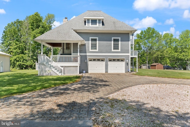 21 Heisler Ave, Charlestown, MD 21914 - view of front facade featuring stairs, covered porch, decorative driveway, a garage, and a front lawn